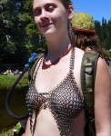 Emily wearing a chain mesh bra she made herself.